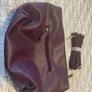 Purple purse with shoulder strap. Never used.